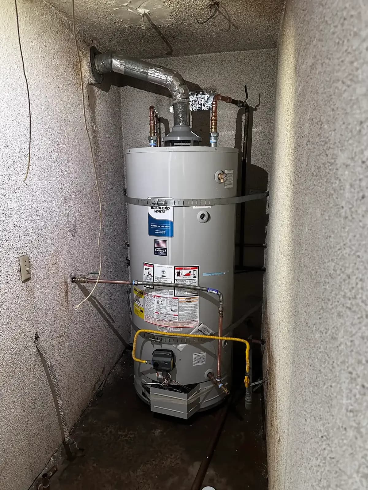 A high-efficiency tank water heater with code-compliant venting and copper connections