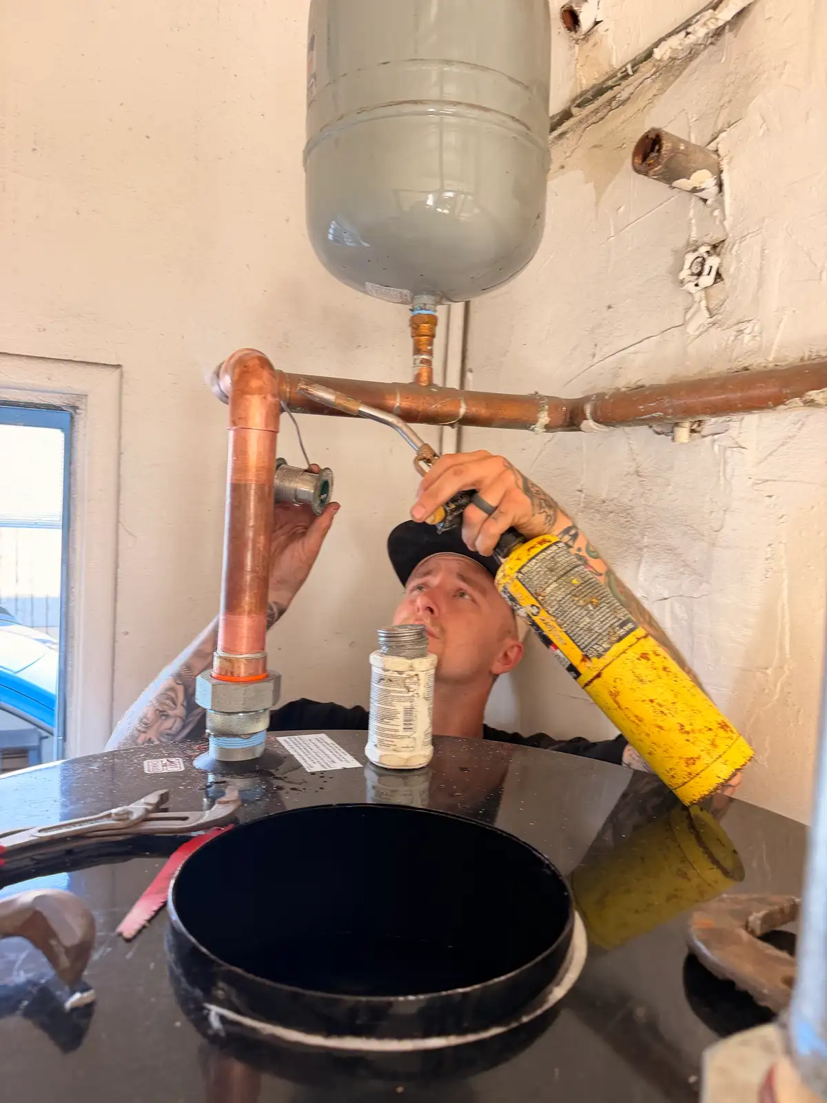 New copper fittings and clean soldered connections after a water line repair
