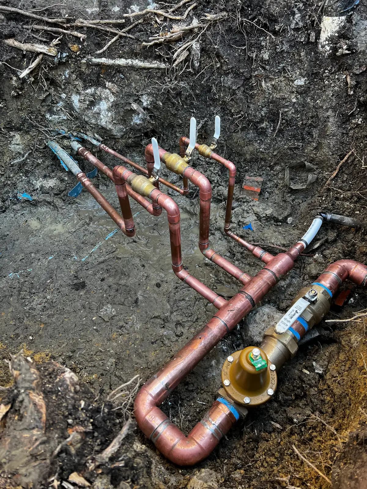 A new copper main water service line run from the meter into the house