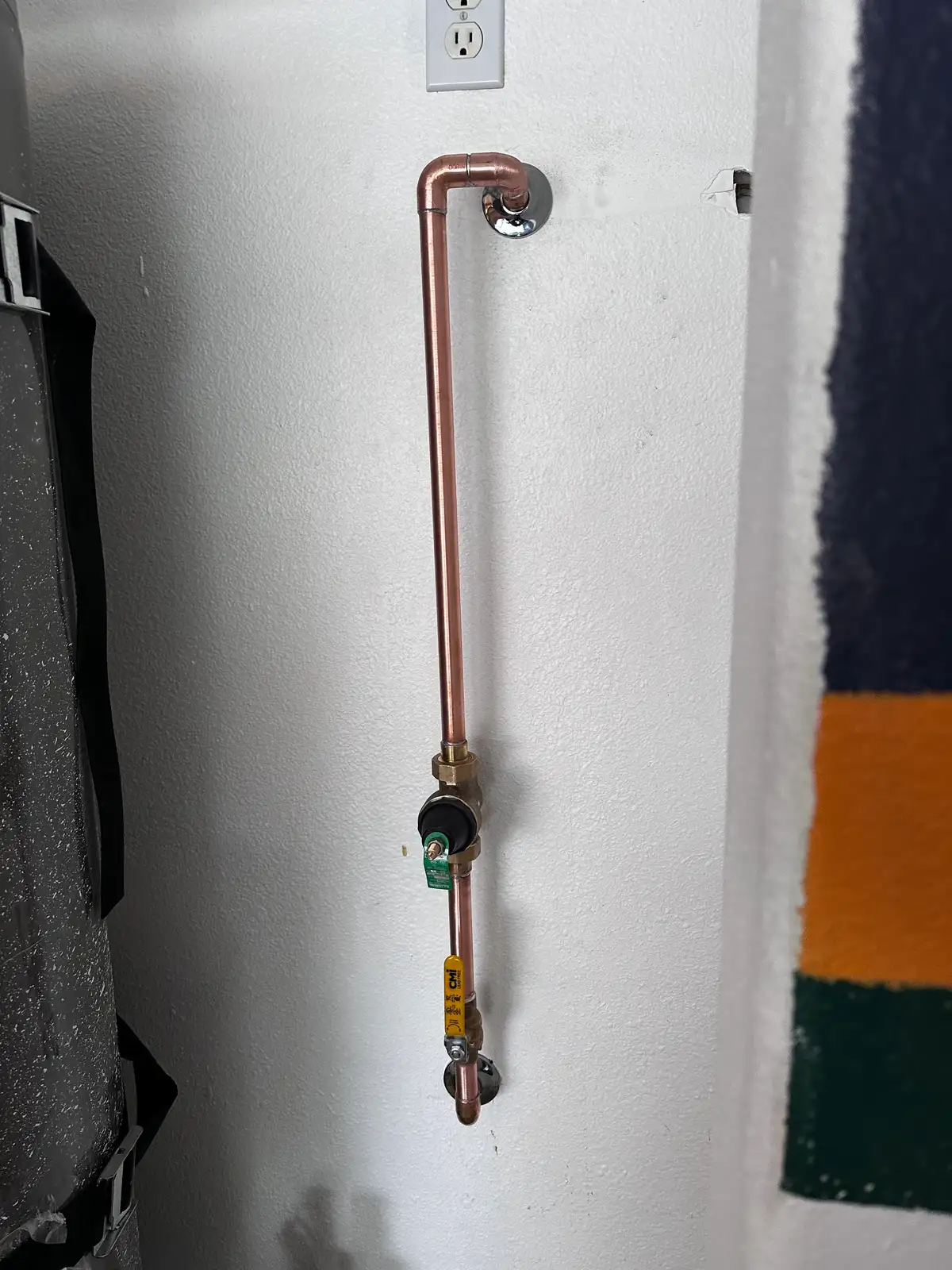 A pressure reducing valve installed on the main line with a gauge beside it