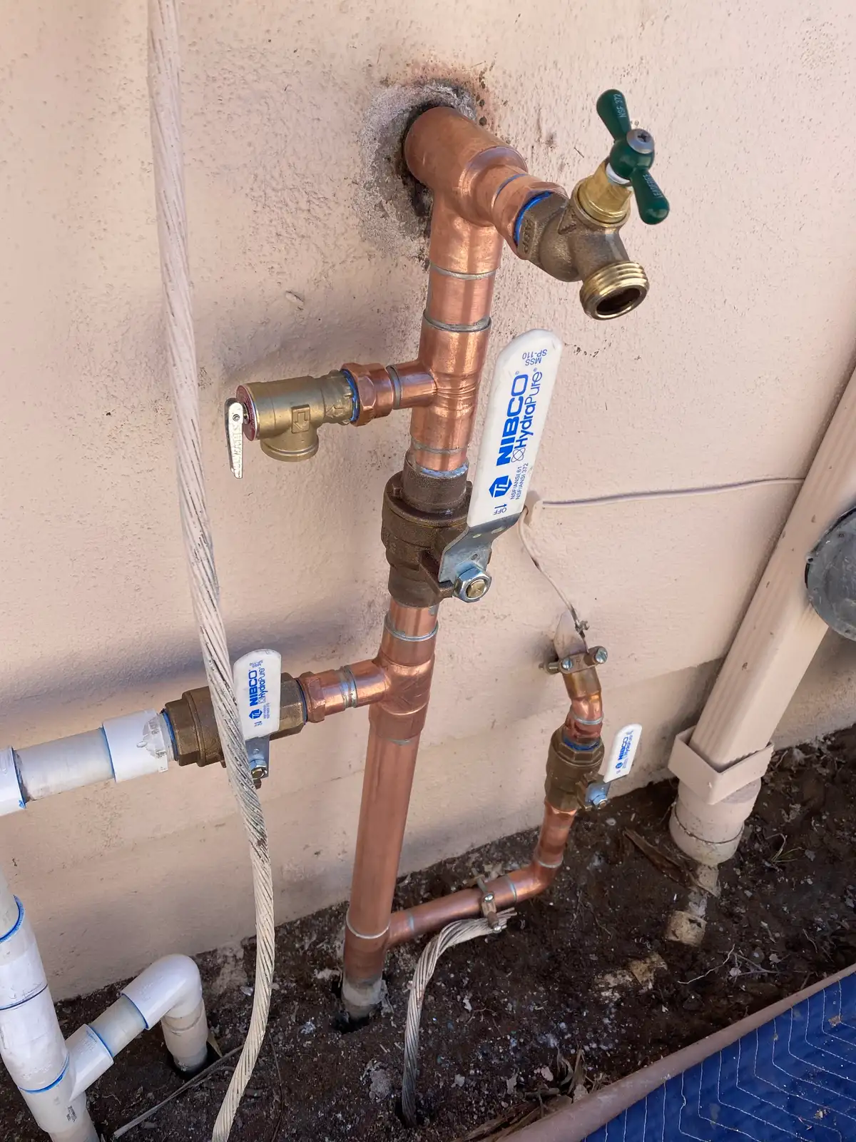 A home-run water manifold with a separate labelled line leaving it for each fixture in the house